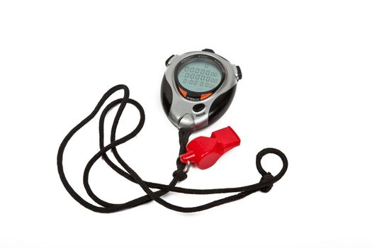 digital stop watch and red whistle on white background