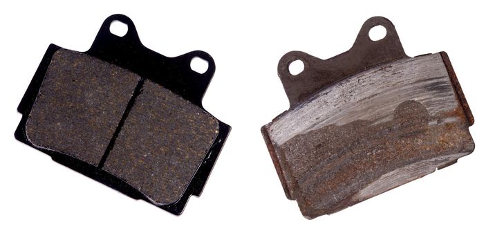 New and worn brake pad, isolated on background