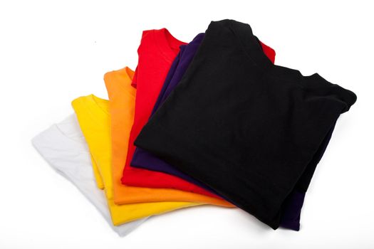 a stack of t-shirts isolated on white background