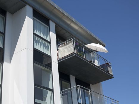 Modern condominium at summertime by the waterfront of Nyborg Denmark. Space for text.