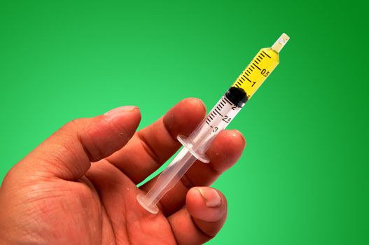 Syringe and hand