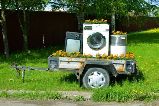 Trailer with home appliances. Tv and washing machine