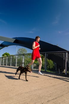 Sportsman and dog running outdoors