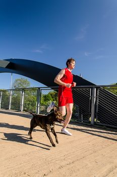Sportsman and dog running outdoors