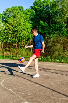 Guy is training with the ball on the court