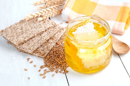 honey with crispbread and wheat grain