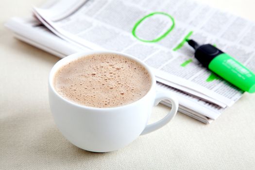 Morning coffee with newspaper