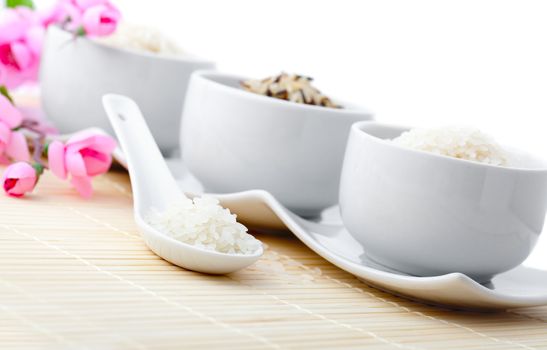 porcelain bowls of uncooked rice