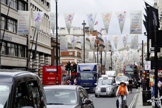 LONDON, UK, Friday June 1, 2012. Flags on Piccadilly to advertise the Piccadilly Big Jubilee Lunch which will be held on Sunday June 3, 2012.