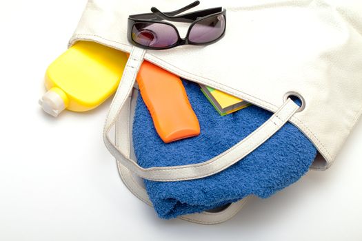 Beach Bag with Towel and Bottles Cream, closeup