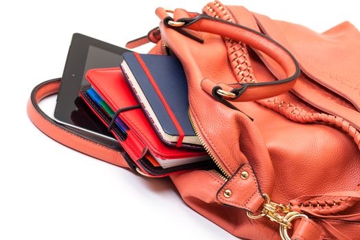 Pink Leather Ladies Handbag with Tablet PC on white background