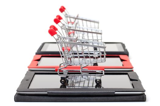 Shopping Cart over a Tablet PC on white background