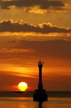 sunset over a lighthouse from southeast asia