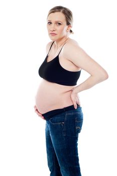 Worried pregnant woman having pain in her stomach