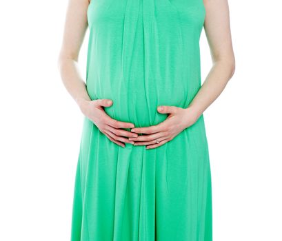 Cropped image of pregnant woman in green dress