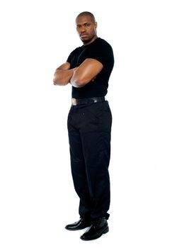 Male security guard with strong arms crossed on white background