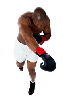 Attractive black male boxer over white background