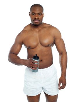 Athlete posing with health drink bottle isolated over white