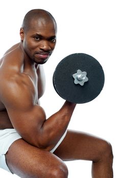 Portrait of happy fit african man working out with dumbbells