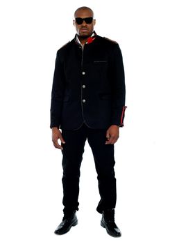 Fashionable african male dressed in black attire against isolated white background