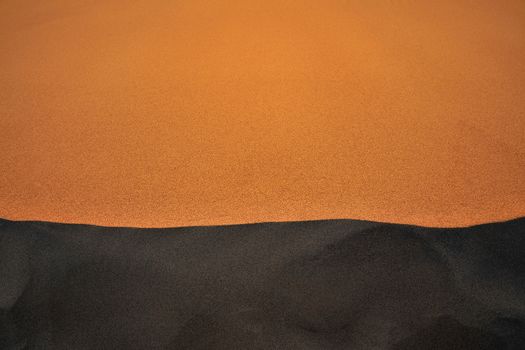 a shadow of sand dune from death valley national park