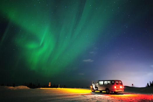 aurora or northern light from alaska with a truck van