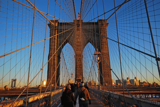 the famous brooklyn bridge with sunlight in evening