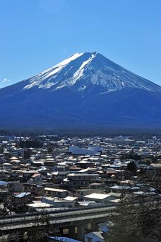 Mount Fuji and many roof in a town called "Fujisan"