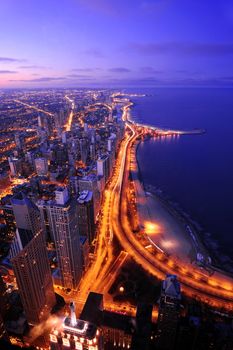 a road along lake michigan in chicago at night