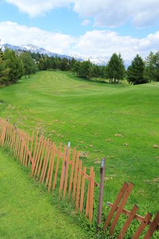 Golf course and fence by summer, Crans Montana, Switzerland