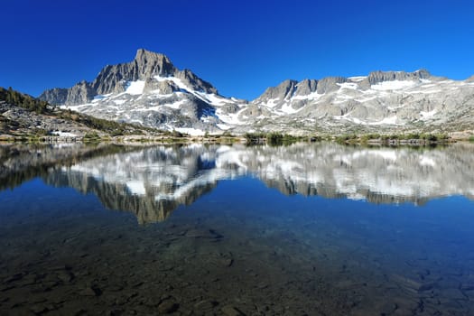 a reflection of banner peak at thousand island lake, eastern sierra lake, california