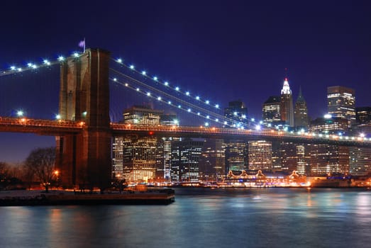 brooklyn bridge from new york city at night