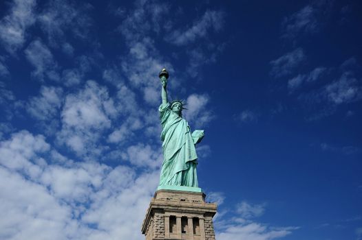 Statue of Liberty with blue sky and clouds