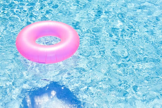 pink rubber ring in swimming pool