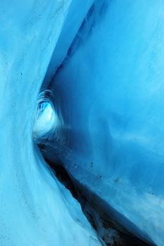 a blue ice cave from Root Glacier at Alaska