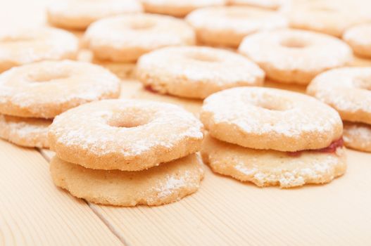 Closeup of Traditional Linzer Cookies on Wooden Board