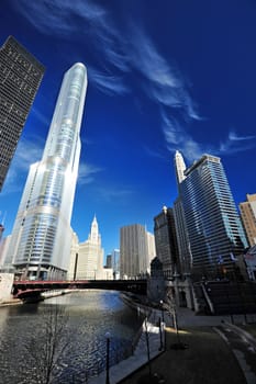 tall building along chicago river with blue sky