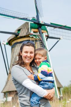 Mother and son near windmill in Holland