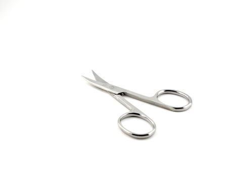 Nail scissors over white