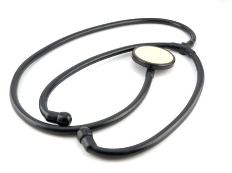 Old stethoscope over white
