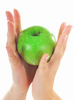 Green fresh apple in beutiful female hands with nice manicure isolated on white background