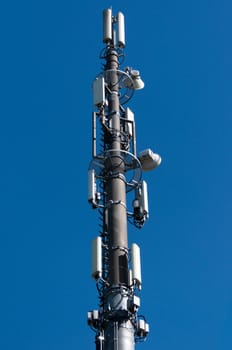 Communication tower with satellite dishes and aerials