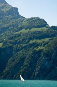 Sailing Boat, Windsurfer and Mountains at Lake Lucerne, Switzerland