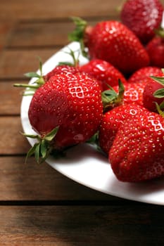 a plate of fresh strawberries