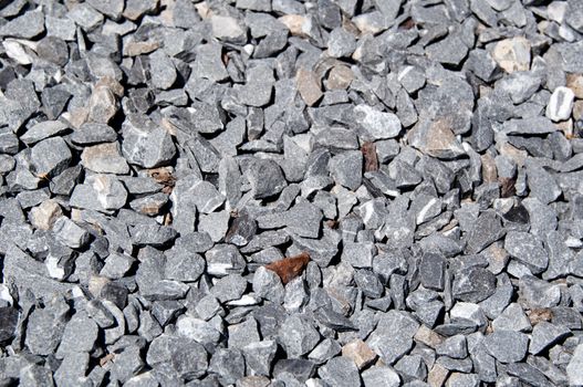 Granite marble stones background (texture) - grey with single brownish stones
