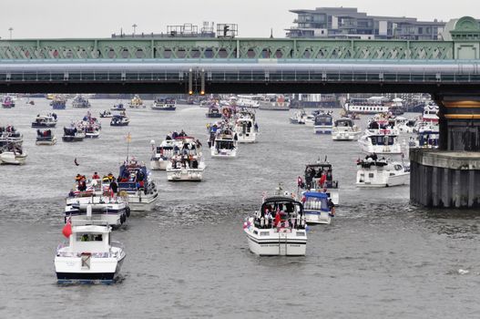 LONDON, UK, Sunday June 3, 2012. Hundred of boats muster on the river Thames in Putney (west London) for the Thames Diamond Jubilee Pageant to celebrate the Queen's Diamond Jubilee.