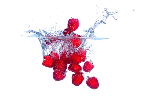 Red Raspberries Falls under Water with a Splash, isolated