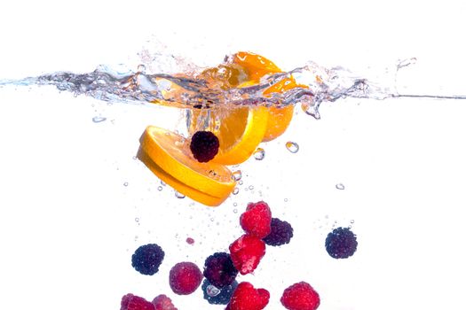 Fresh Fruit Falls under Water with a Splash, isolated