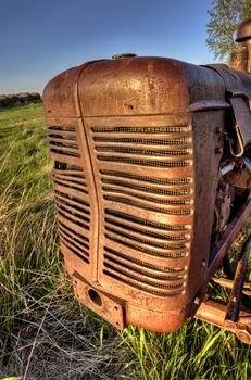 Antique Farm Equipment sunset Saskatchewan Canada