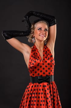 Young dancer woman in red dress.